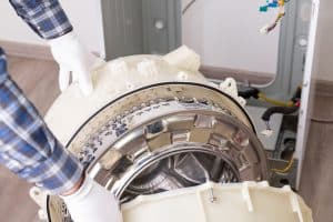 Repairing,Washer,In,Service,Centre.,Handyman,Completely,Disassembled,Washing,Machine
