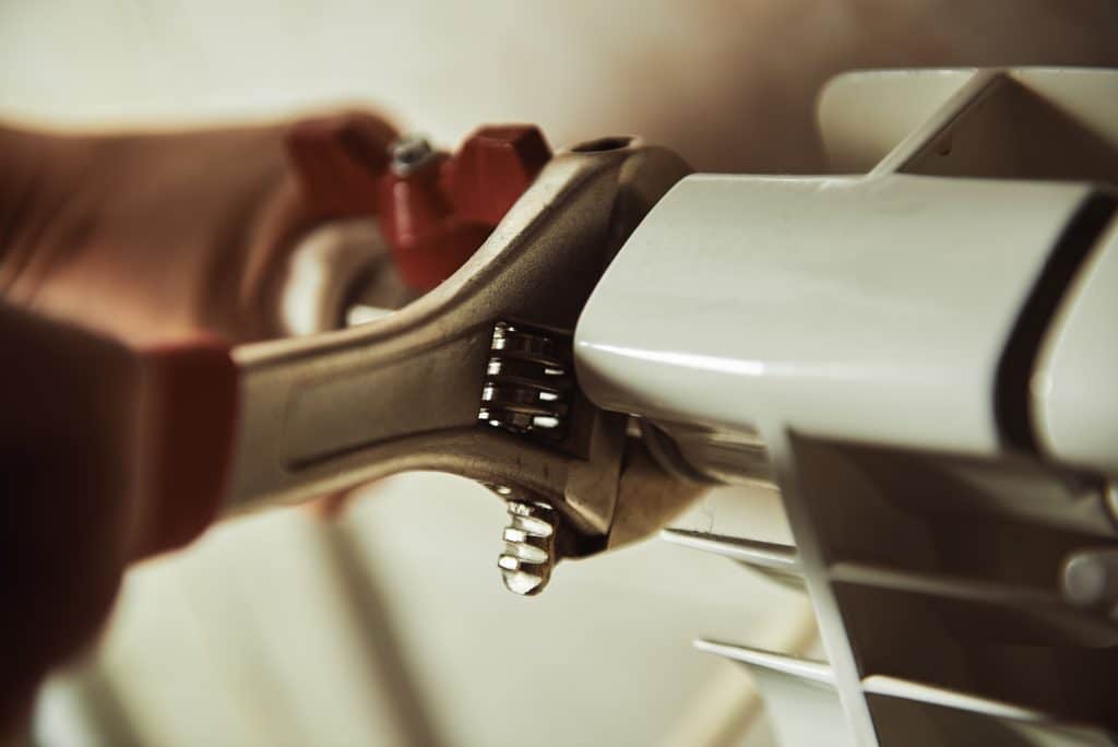 Plumbing,Repair,Service.,Professional,Installer,With,Spanner,Checking,Pipes.