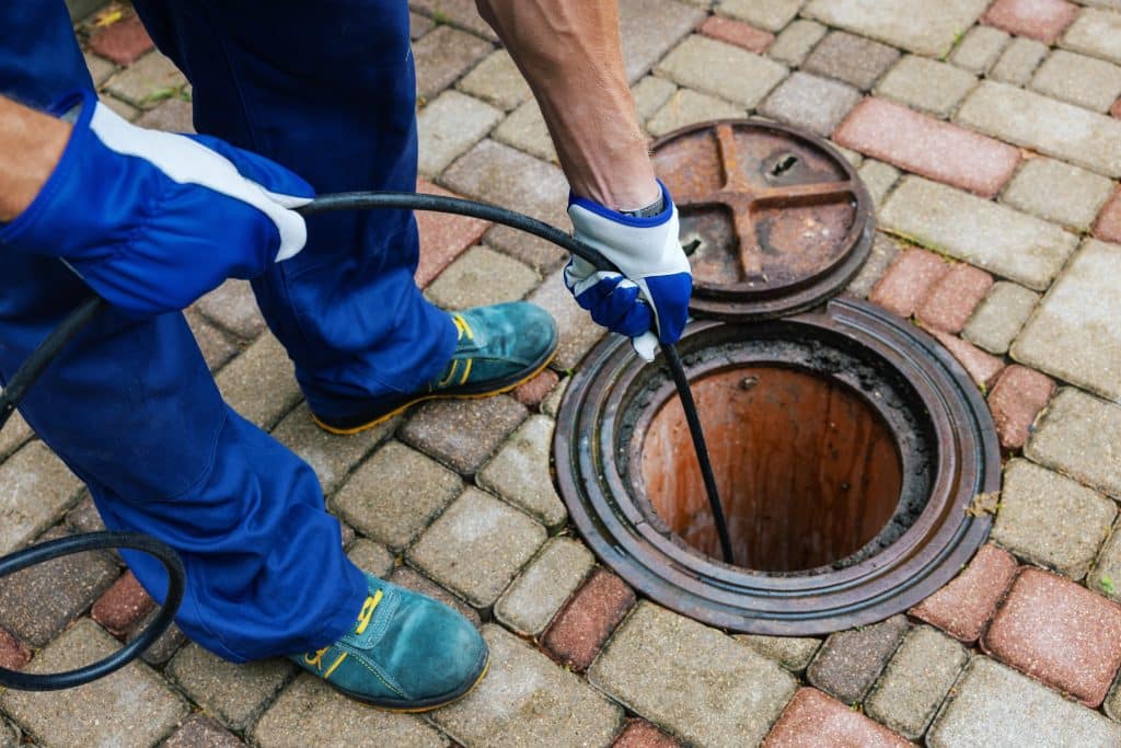 Sewer,Cleaning,Service,-,Worker,Clean,A,Clogged,Drainage,With